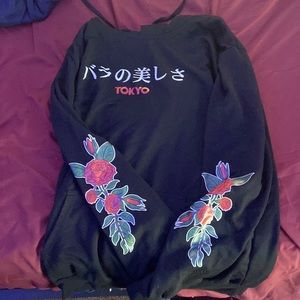 This is a extra large Tokyo, custom hoodie with roses on the sleeves